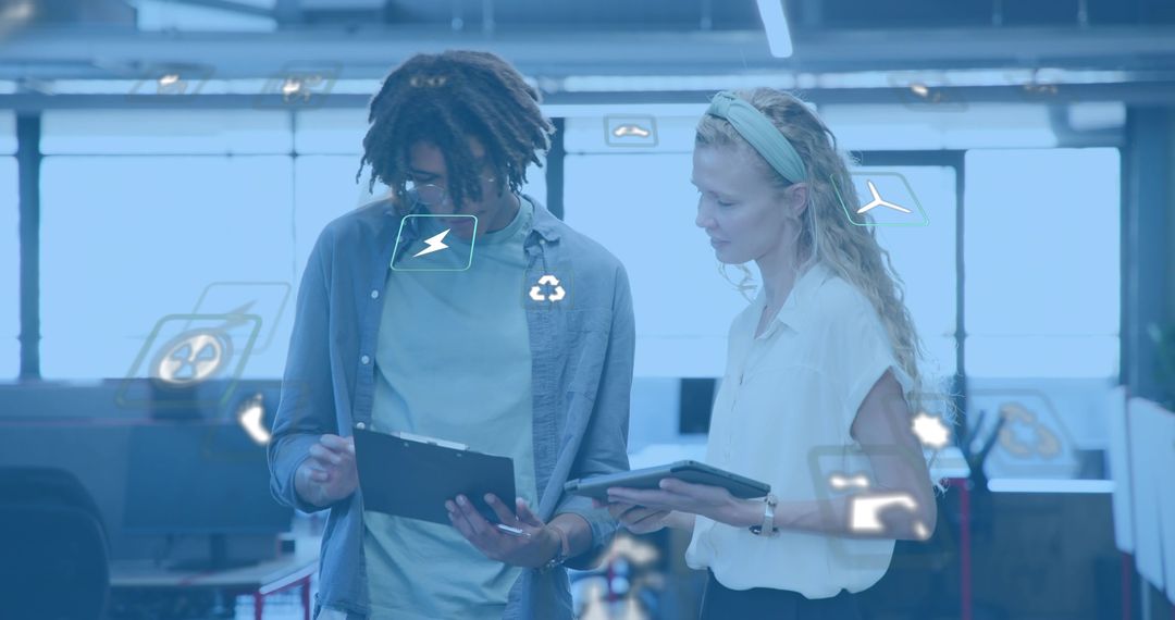 Young professionals discussing sustainable tech collaboration in modern open-plan office