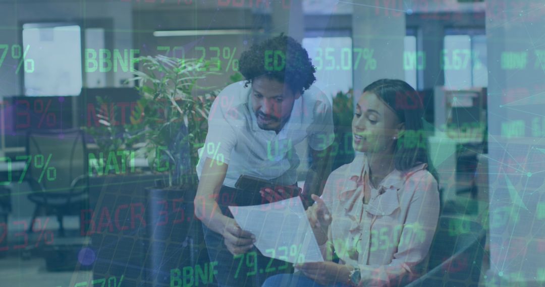 Colleagues Discussing Financial Report in Modern Office Setting