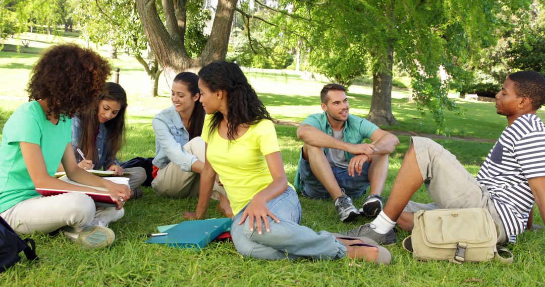 Group of Diverse College Students Studying and Relaxing Outdoors - Free Images, Stock Photos and Pictures on Pikwizard.com