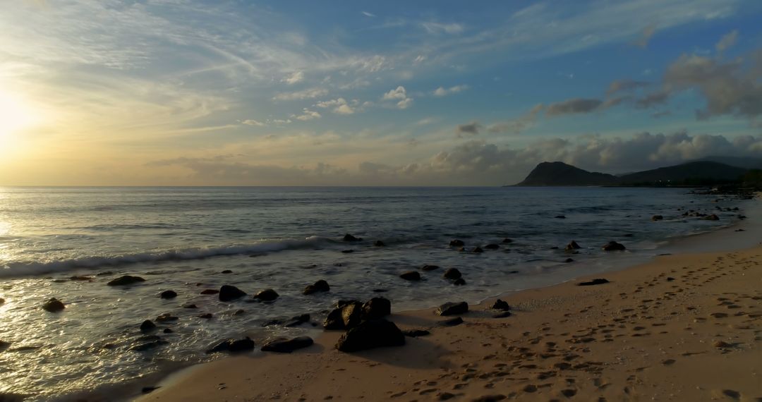 Beautiful Tropical Beach with Golden Sunset and Calm Waves - Free Images, Stock Photos and Pictures on Pikwizard.com