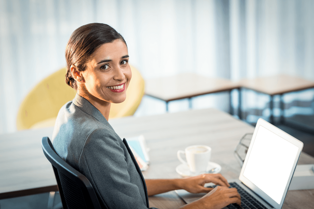 Transparent Smiling Businesswoman Using Laptop in Modern Office
