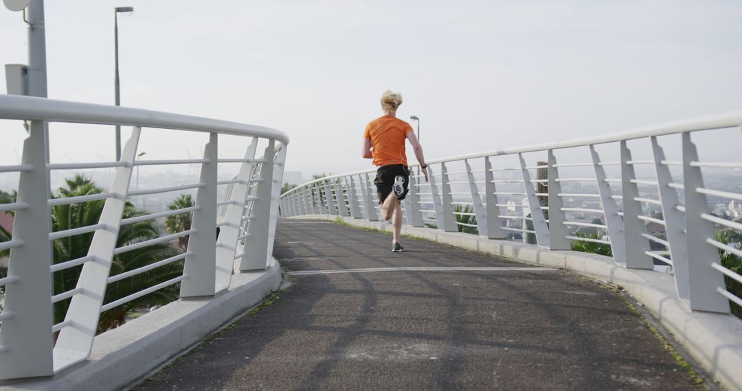 Person Running on Raised Pathway in Urban Park - Free Images, Stock Photos and Pictures on Pikwizard.com