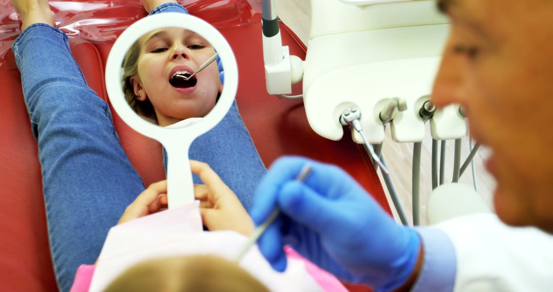 Child Dental Check-Up with Dentist Reflection in Mirror - Free Images, Stock Photos and Pictures on Pikwizard.com