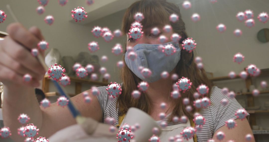 Masked Artisan Creating Pottery in Workshop