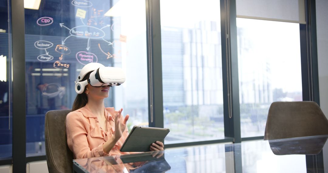 Businesswoman using VR headset in innovative tech office environment