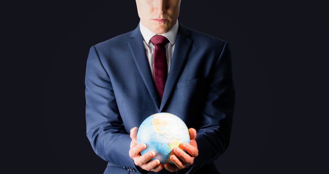 Businessman Holding Global Sphere, Symbolizing Global Business - Free Images, Stock Photos and Pictures on Pikwizard.com