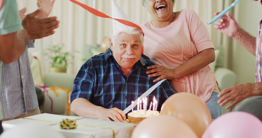 Senior Man Celebrating Birthday with Joy - Free Images, Stock Photos and Pictures on Pikwizard.com