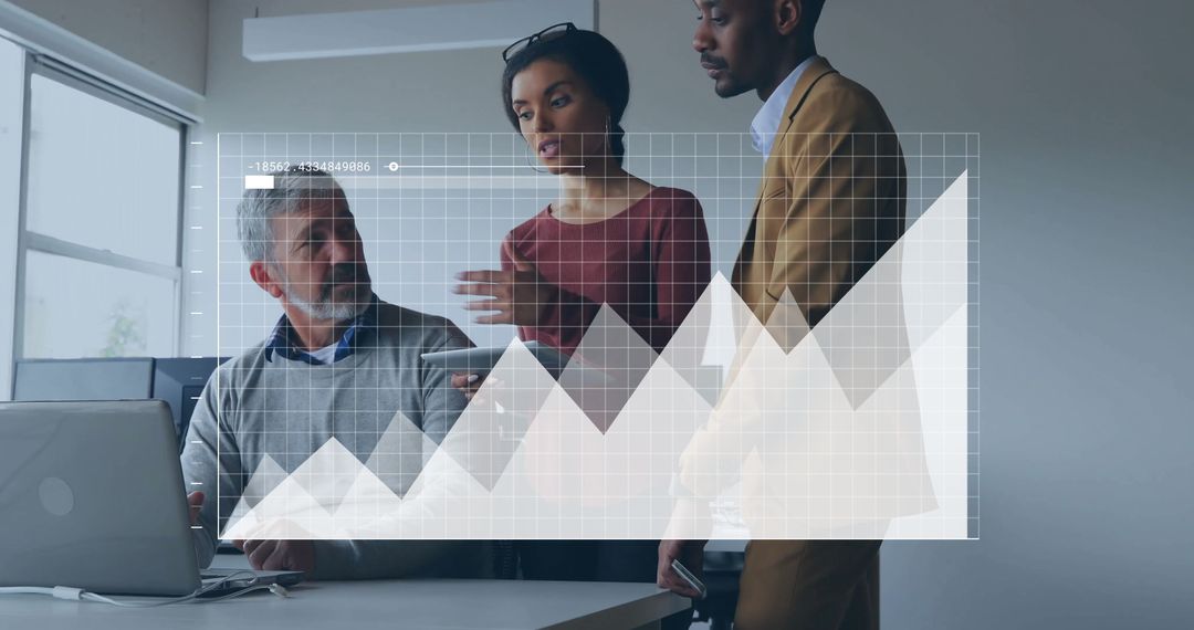 Diverse Team Analyzing Data Trends in Modern Workspace