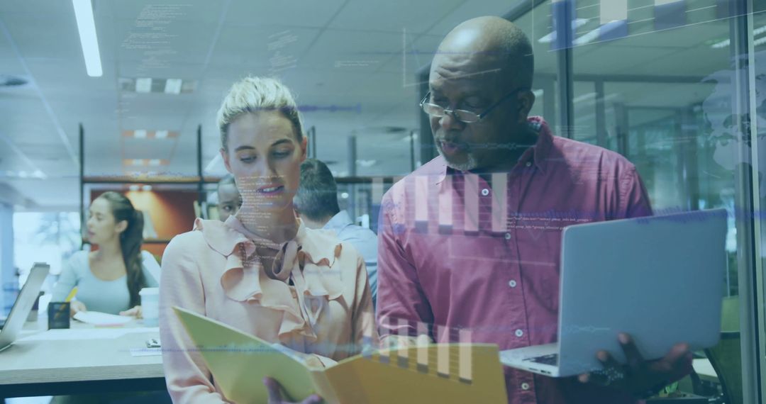 Diverse Colleagues Analyzing Financial Software in Modern Office