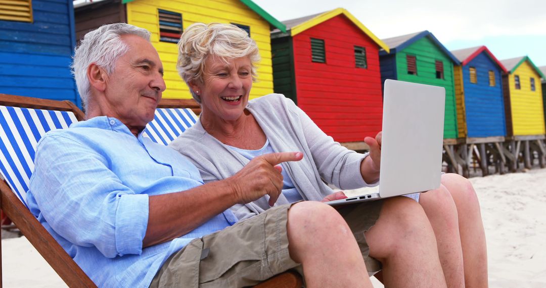 Senior Couple Enjoying Beach While Using Laptop - Free Images, Stock Photos and Pictures on Pikwizard.com