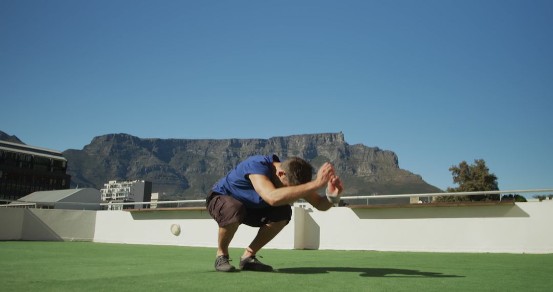 Man Practicing Yoga Outdoors with Mountain View - Free Images, Stock Photos and Pictures on Pikwizard.com