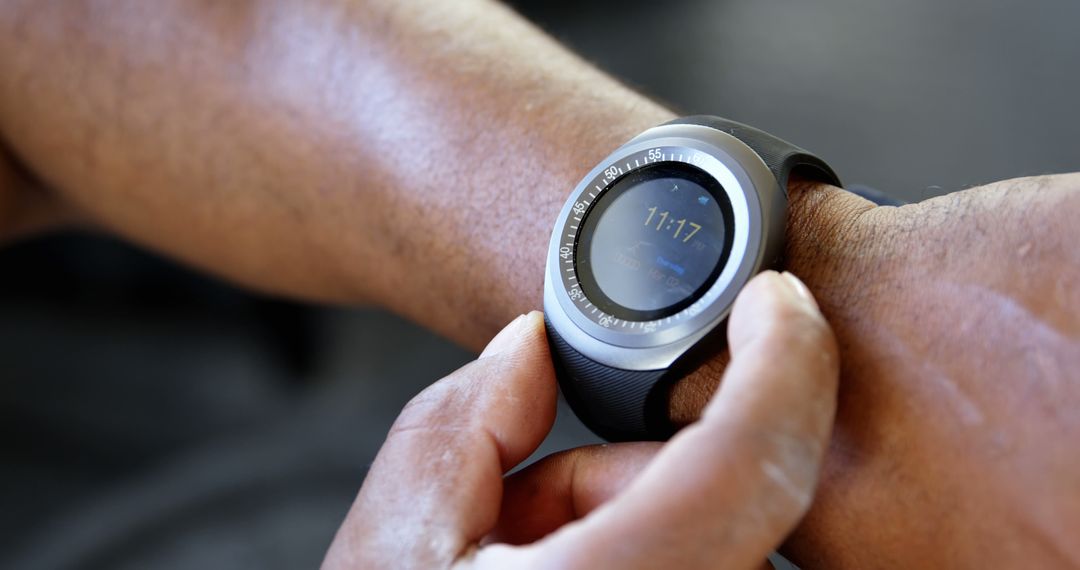 Close-up of Person Wearing Smartwatch with Finger Interacting - Free Images, Stock Photos and Pictures on Pikwizard.com