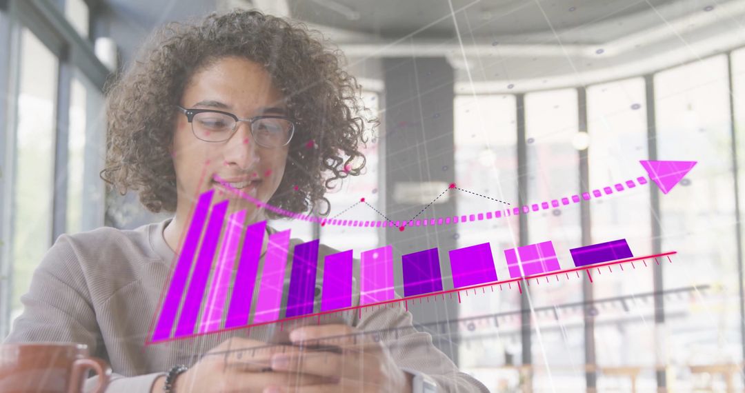 Young Man Analyzing Financial Data on Smartphone