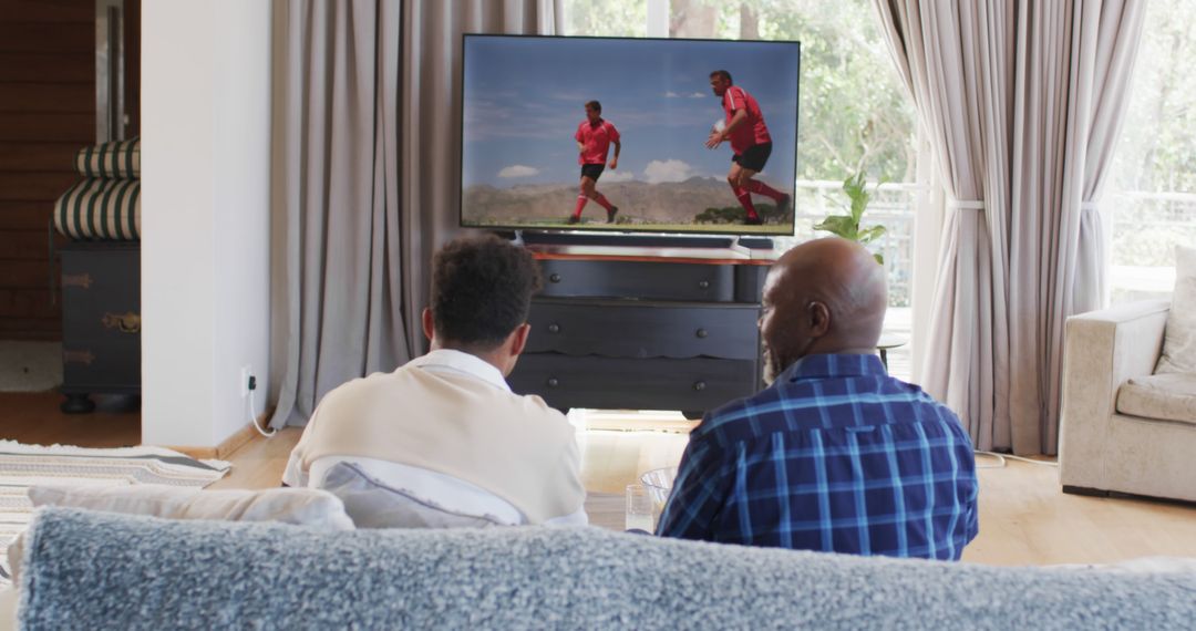 Men Watching Soccer Game on TV in Living Room - Free Images, Stock Photos and Pictures on Pikwizard.com