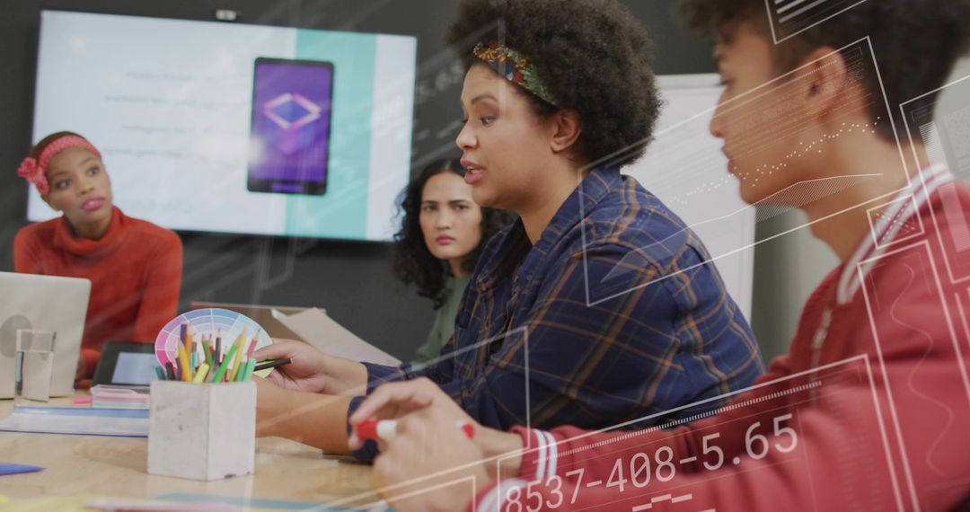 Creative Design Team in Modern Meeting with Digital Overlays