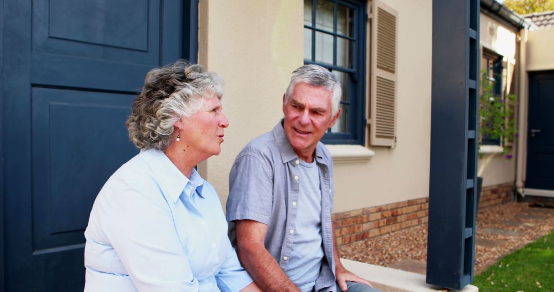 Elderly Couple Relaxing and Talking Outside Home - Free Images, Stock Photos and Pictures on Pikwizard.com