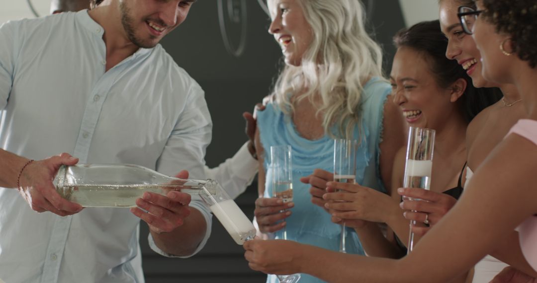 Friends Enjoying Celebration with Champagne Toast and Laughter