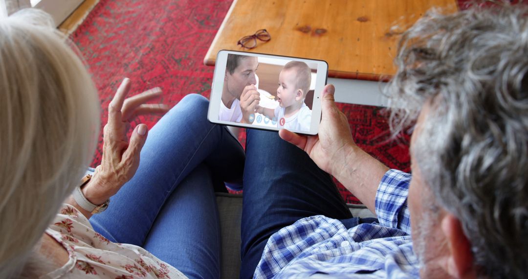 Grandparents Video Chatting with Baby on Tablet - Free Images, Stock Photos and Pictures on Pikwizard.com