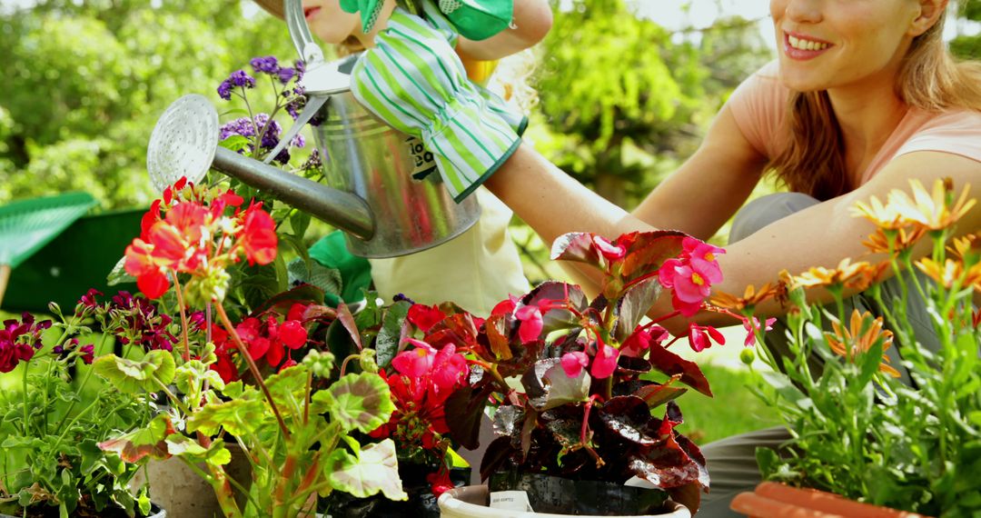 Mother and Daughter Watering Colorful Flowers in Garden - Free Images, Stock Photos and Pictures on Pikwizard.com