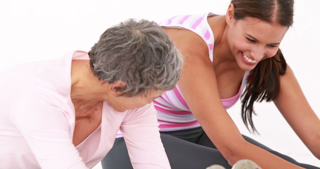 Senior Woman and Young Woman Exercising Together in Fitness Class - Free Images, Stock Photos and Pictures on Pikwizard.com