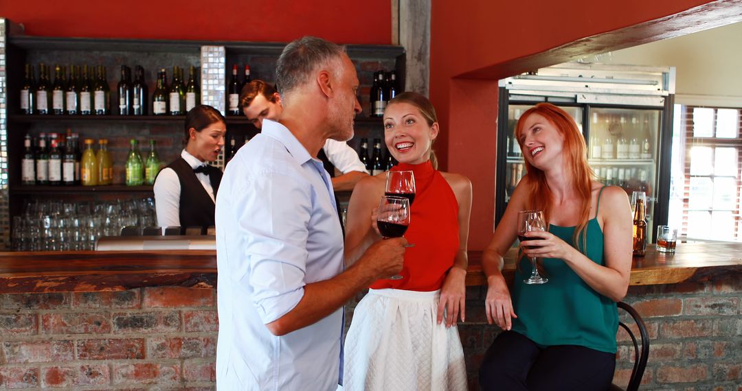 Friends Socializing at Modern Bar Enjoying Wine