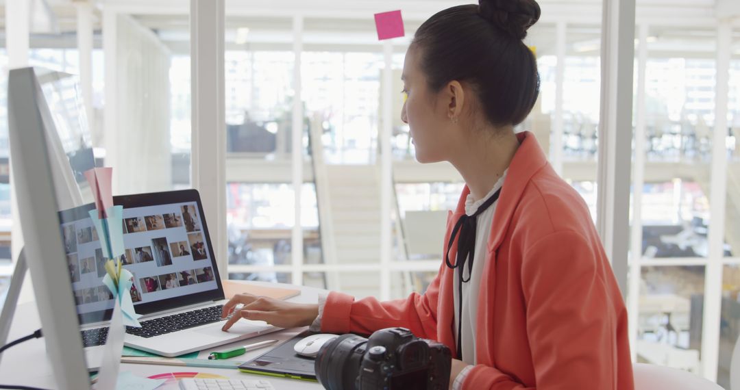 Female Photographer Editing Photos on Computer in Modern Office - Free Images, Stock Photos and Pictures on Pikwizard.com