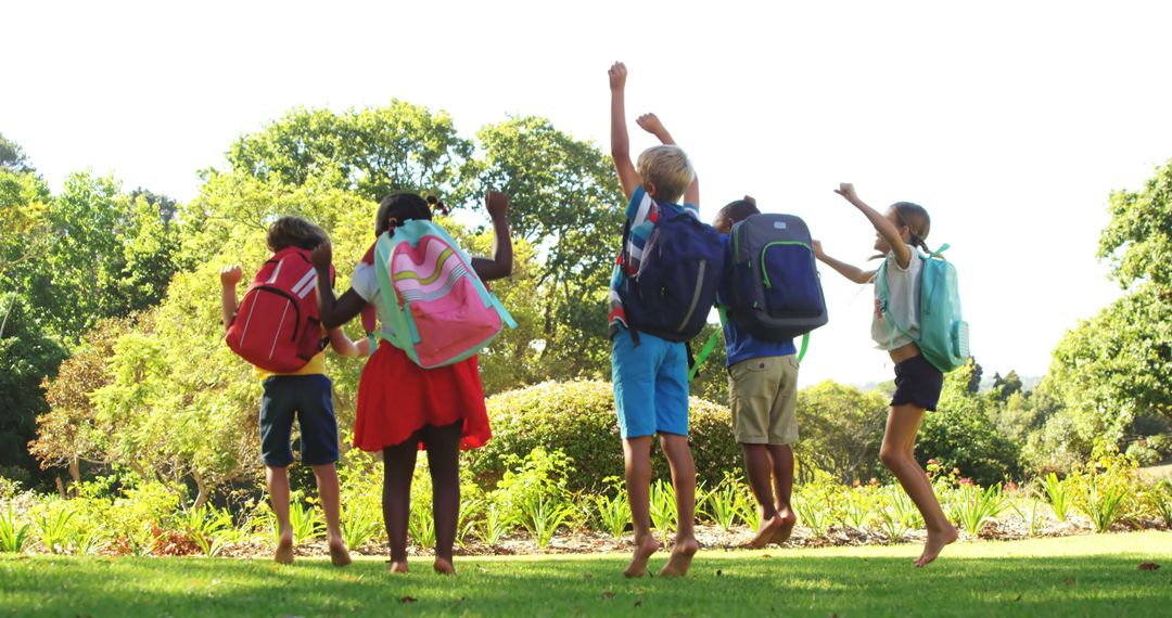 Joyful Children Celebrating Outdoors in Sunny Park