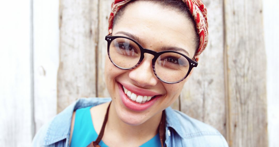 Smiling Woman with Glasses and Headscarf Posing Outdoors - Free Images, Stock Photos and Pictures on Pikwizard.com