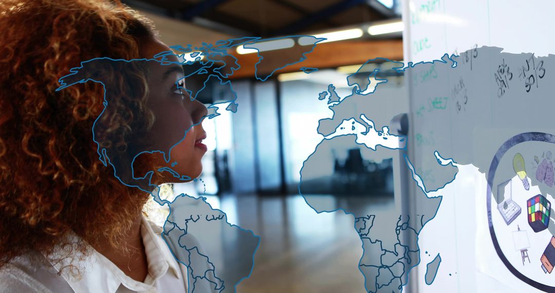 Businesswoman Strategizing with Global Map and Diagrams in Modern Office
