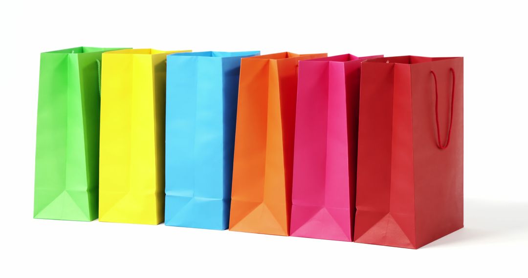 Colorful Shopping Bags in a Row on White Background - Free Images, Stock Photos and Pictures on Pikwizard.com