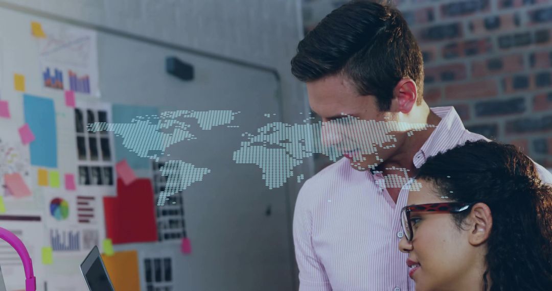 Creative Coworkers Examining Digital Map in Technology Workspace