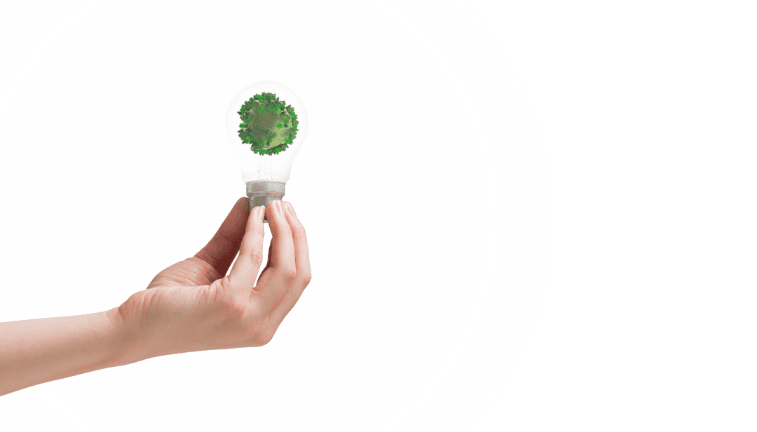 Hand Holding Transparent Light Bulb with Green Environment Concept