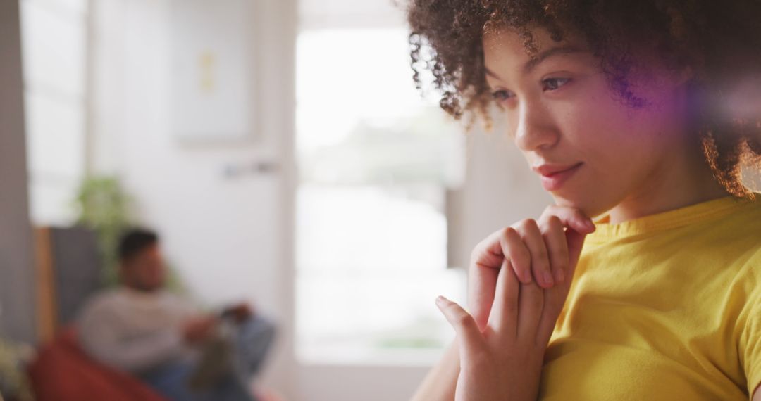 Thoughtful Young Woman in Casual Office Setting