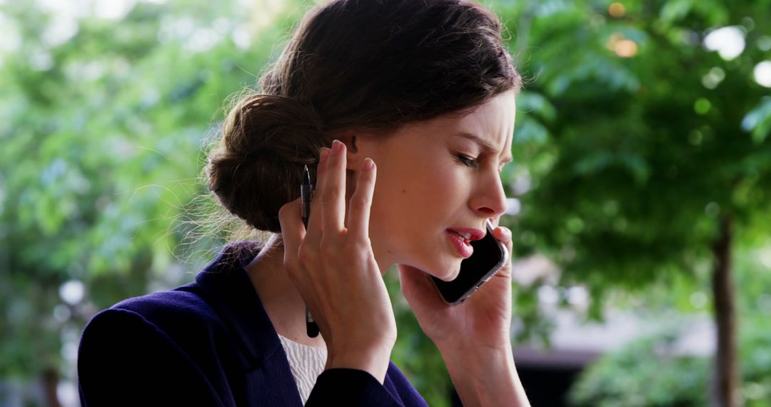 Stressed Businesswoman Talking on Phone Outdoors - Free Images, Stock Photos and Pictures on Pikwizard.com