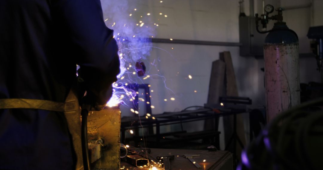 Industrial Worker Welding with Sparks and Smoke - Free Images, Stock Photos and Pictures on Pikwizard.com