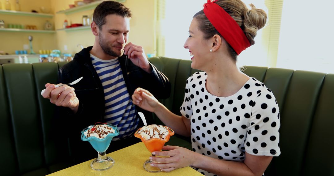 Couple Enjoying Ice Cream Sundaes in Retro Diner - Free Images, Stock Photos and Pictures on Pikwizard.com