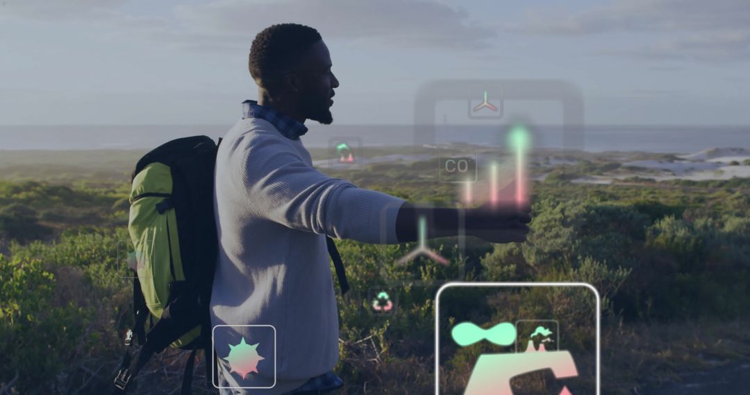 Hiker Interacting with Environmental Data in Natural Setting