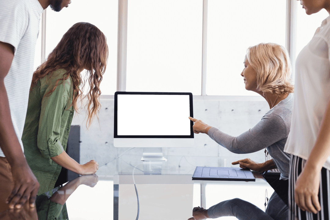 Colleagues Engaged in Collaborative Office Meeting on Transparent Screen