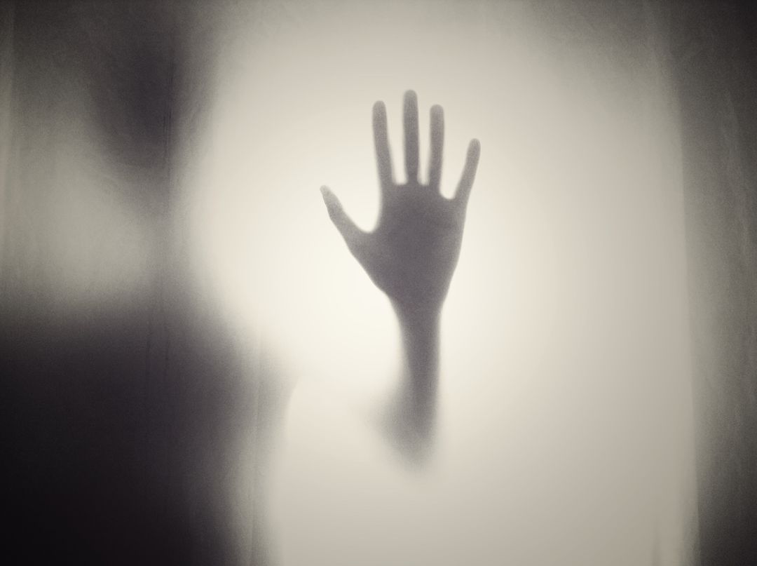 Mysterious Hand Silhouette Against Opaque Glass Backdrop - Free Images, Stock Photos and Pictures on Pikwizard.com