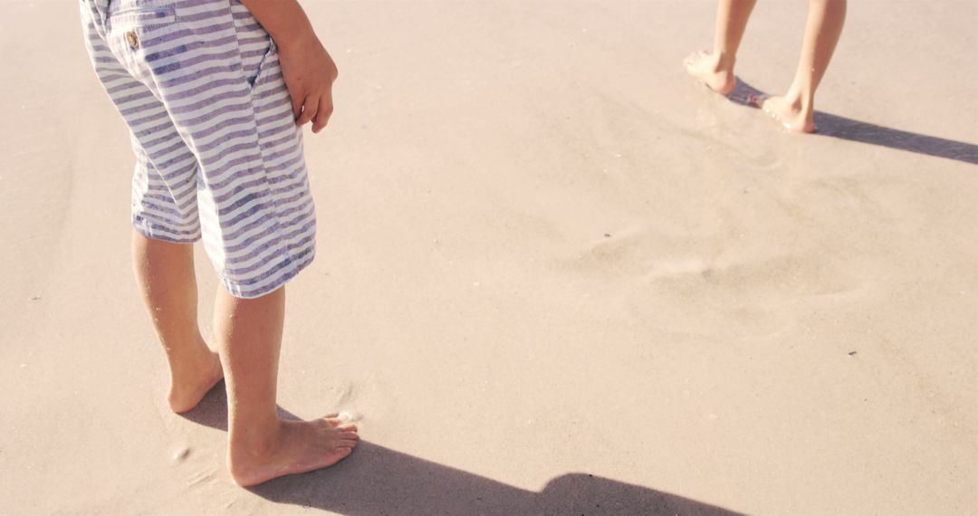 Close-up of Barefoot Children on Sandy Beach - Free Images, Stock Photos and Pictures on Pikwizard.com