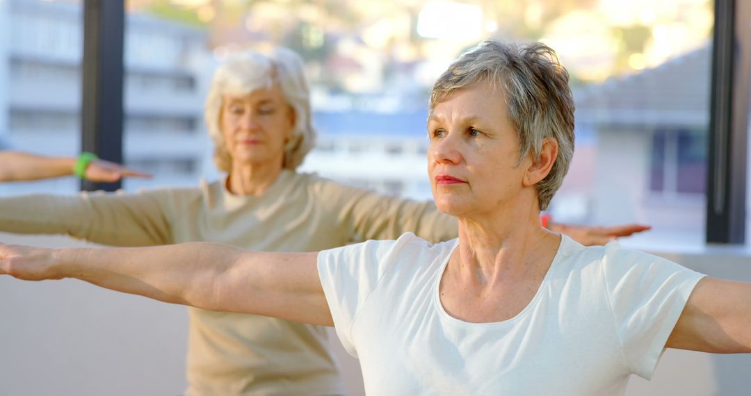 Senior Women Practicing Yoga in Bright Modern Studio - Free Images, Stock Photos and Pictures on Pikwizard.com