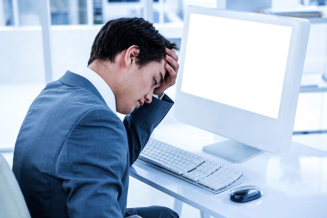 Frustrated Businessman Holding Head with Transparent Computer Screen
