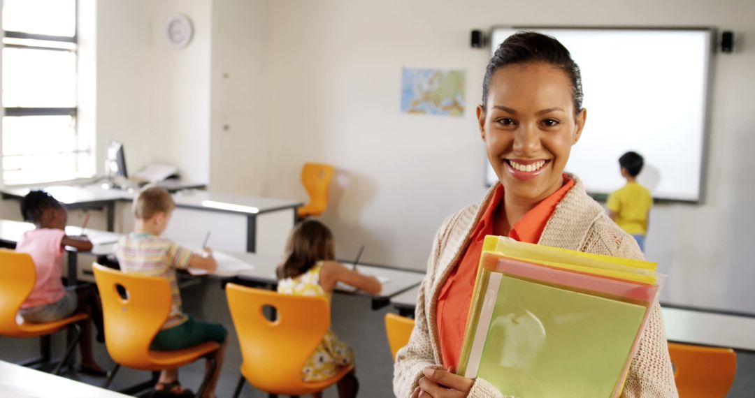Smiling Teacher in Classroom with Attentive Students