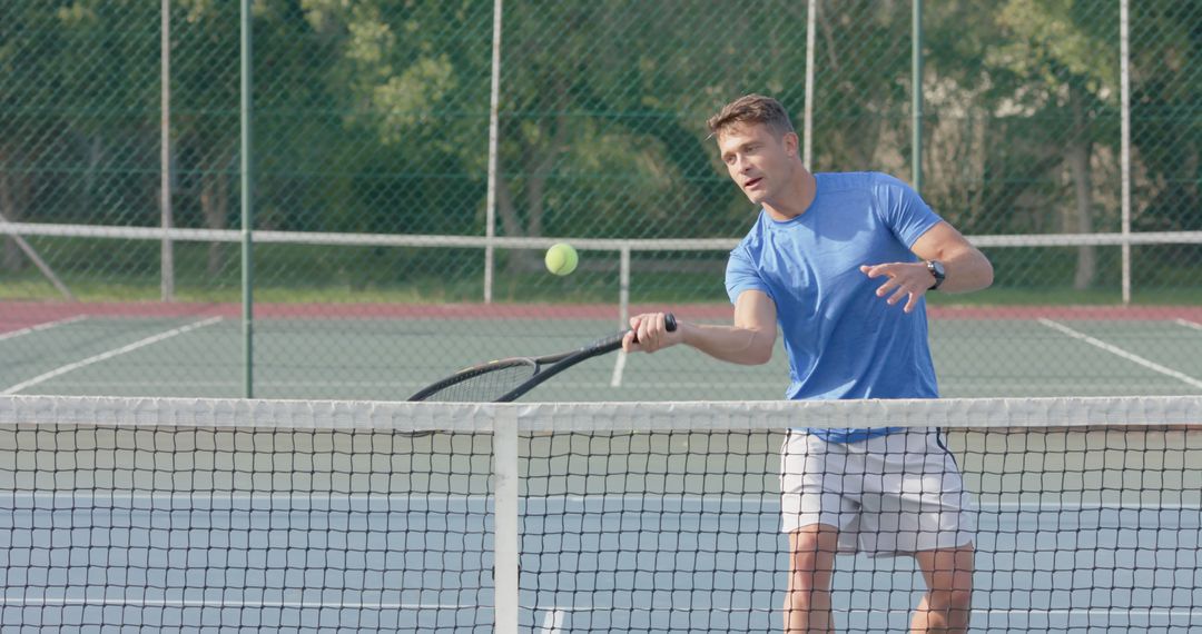 Young Man Playing Tennis on Outdoor Court - Free Images, Stock Photos and Pictures on Pikwizard.com