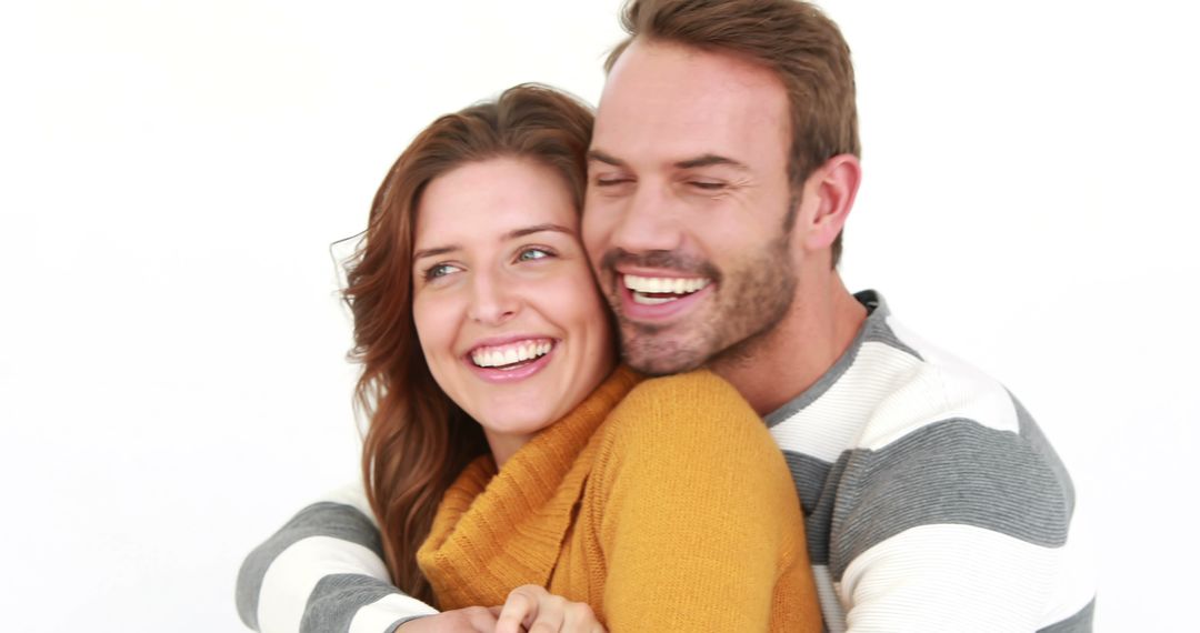 Happy Couple Embracing with Joyful Smiles