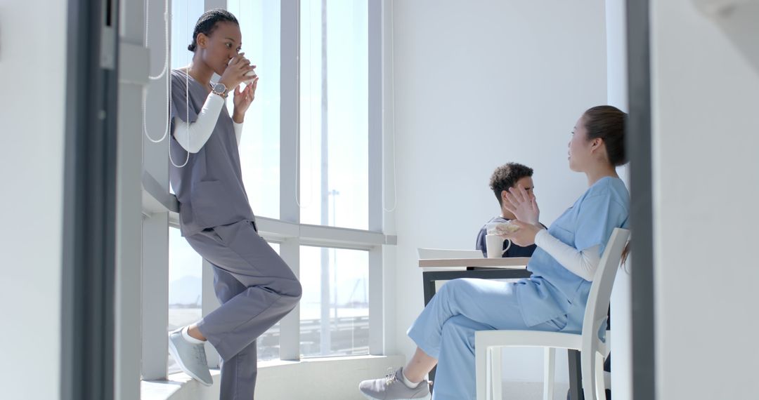 Healthcare Workers Relaxing During Break in Hospital - Free Images, Stock Photos and Pictures on Pikwizard.com