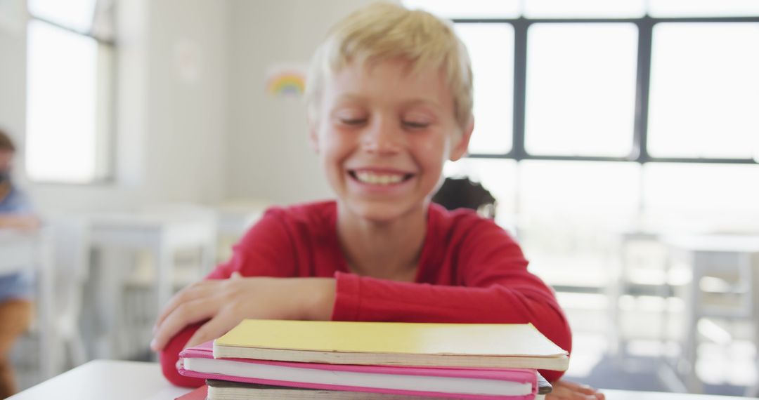 Smiling Caucasian Boy in Classroom with Books - Free Images, Stock Photos and Pictures on Pikwizard.com