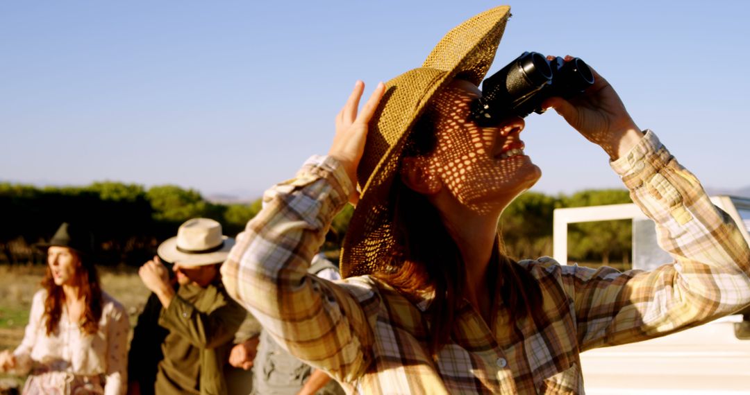 Young Woman Using Binoculars During Safari Adventure - Free Images, Stock Photos and Pictures on Pikwizard.com