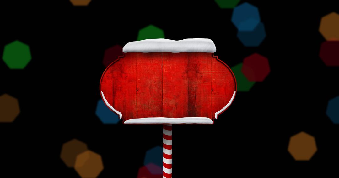 Red Christmas Sign with Snow Detail Against Bokeh Background
