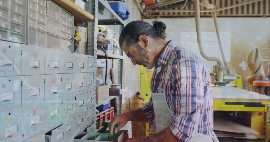 Craftsman Organizing Workshop Supplies in Productive Workspace